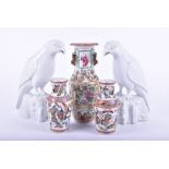 A pair of blanc de chine birds of prey along with a Cantonese famille rose vase and two butterfly