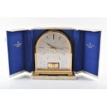 A 1960s Jaeger-le-Coultre 'Borne' Atmos clock in fitted case of arched form with twin bands of