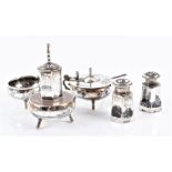 An early 20th century five-piece miniature niello white metal cruet set  each with landscape