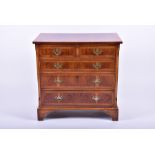 A reproduction yew wood chest with two short over three long drawers, on bracket feet, 74 cm x 76 cm