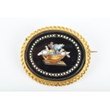 A yellow metal mounted micro-mosaic brooch of oval form, depicting an image of the Doves of Pliny,