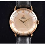 An Omega 9ct yellow gold automatic wristwatch the silvered dial with applied numerals and pointer