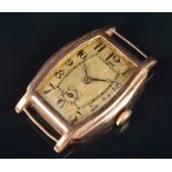 A 1930s 9ct gold mechanical wristwatch the silvered dial with black Arabic numerals and subsidiary