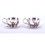 A pair of rare 19th century Chinese silver and enamel tea cups and saucers attributed to Huang Qiu