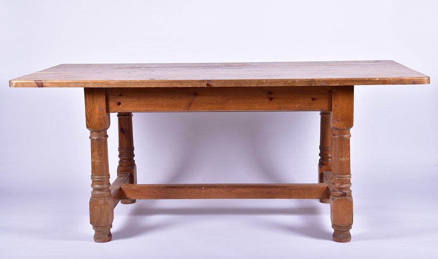 A 20th century pine kitchen table 183 cm x 89 cm x 77 cm high.