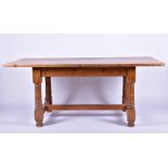 A 20th century pine kitchen table 183 cm x 89 cm x 77 cm high.