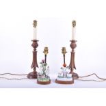 A pair of Indian carved wooden table lamps 46 cm high; together with a pair of small Staffordshire