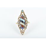 An unusual gold, opal, and composite gemstone ring centred with a marquise doublet of blue glass,