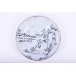 An 18th century Chinese 'En Grisaille' plate Qianlong period, the plate decorated with a pair of