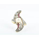 A yellow gold, diamond, ruby, and pearl ring of swirled form, the s-shaped mount centred with a