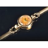 A Jaeger Le-Coultre ladies 9ct gold wristwatch the gilt dial with Arabic numerals and baton hour