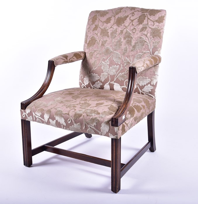 A Georgian mahogany 'Gainsborough' style open armchair having a bow shaped back, padded arm supports