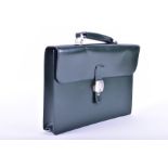 A green leather gentleman's briefcase by Dunhill with internal sections for a laptop, pens, files