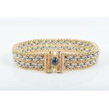 A 14ct yellow and white gold woven link bracelet the clasp terminals inset with cabochon