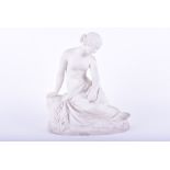 A Minton parian ware classical nude modelled as a robed maiden seated on a rock with her head