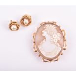 A 9ct yellow gold and cameo brooch depicting a female in profile with wheat and flowers in her hair,