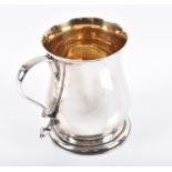 A small George II silver tankard London 1755 possibly by Henry Brind, of baluster form, with
