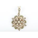 A late 19th / early 20th century seed pearl and peridot pendant of circular starburst form,  the