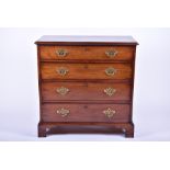 A Georgian mahogany chest of drawers, circa 1800 the moulded top above four long drawers, raised