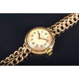 A Jaeger Le-Coultre 9ct yellow gold ladies wristwatch the silvered dial with applied numerals, on