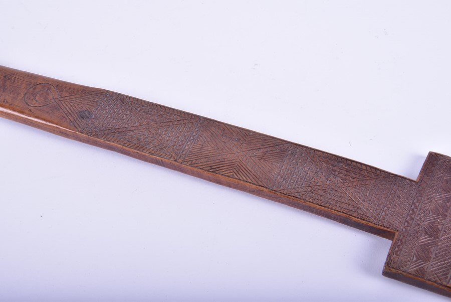 A Polynesian hardwood paddle decorated with pierced head and miniature tightly carved geometric - Image 7 of 8