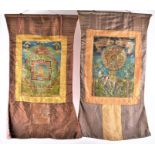 Two Tibetan Thangka silk wall hangings early 20th century, each depicting deities in landscapes,