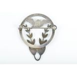 George Jensen. A silver brooch in the form of a stylised bird with foliate detail.
