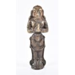 A 19th century Indian bronze figure of a deity in praying stance, 12.5 cm high.