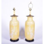 A large pair of Japanese yellow glaze lamps with pate-sure-pate decoration of prunus roots,