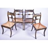 A set of four Regency lacquer chairs with painted chinoiserie decoration and cane seats, on four