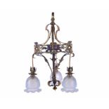 An Arts & Crafts pendant light fitting by W. A. Benson the brass frame with scrolled supports, and