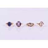 A collection of four various rings to include, a 9ct rose gold lapis lazuli ring; a 9ct gold