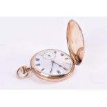 A 9ct yellow gold pocket watch with white enamel Roman numeral dial and second subsidiary dial,