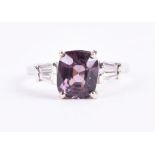 An 18ct white gold, diamond, and spinel ring set with a natural reddish purple coloured spinel of
