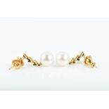 A pair of 18ct yellow gold, diamond, and pearl drop earrings each suspended with a round white