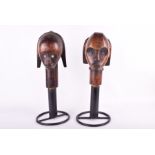 Tribal Art: A pair of Fang Byeri (Gabon) head first half of 20th century, on later metal stands,