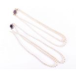 A two row graduated cultured pearl necklace    with a 9 carat gold, amethyst and cultured pearl