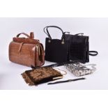 A brown crocodile-style leather handbag circa 1950s, together with two further black handbags, and