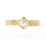 An 18 carat gold lady's Omega wristwatch with integral bracelet, dial approx 14 mm diameterCONDITION