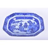 A late 19th century Chinese blue and white elongated octagonal dish depicting a watery landscape