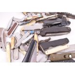 A collection of pocket knives including fruit knives, pruning knives, a silver cased knife and an