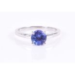 A 14ct white gold and tanzanite ring set with a mixed round-cut tanzanite, approximately 6 mm