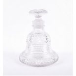 A Continental cut glass decanter designed in a bell shape with hobnail cut to the base and top,