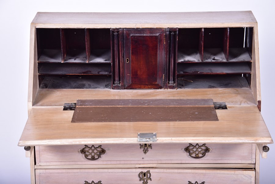 A 20th century child's stripped-wood small bureau the drop opening to reveal a compartmentalised - Image 5 of 6
