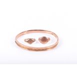 A 9ct rose gold bangle together with two 9ct rose gold signet rings, size P & R.CONDITION REPORT15.7