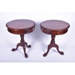 A pair of reproduction mahogany single-drawer drum tables with gadrooned edges, on tripod pedestal