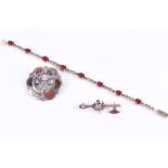 A group of silver jewellery including a silver, red agate, and marcasite line bracelet, and two