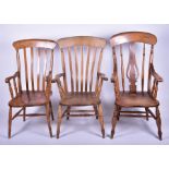 Three 20th century Windsor armchairs of varying styles, the largest 112 cm x 64 cm wide. (3)
