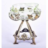 An Art Nouveau silvered brass and glass fruit bowl the open frame base of naturalistic form