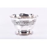 An Arts & Crafts silver rose bowl with embossed floral frieze London 1909, maker G.H, 13 cm high x